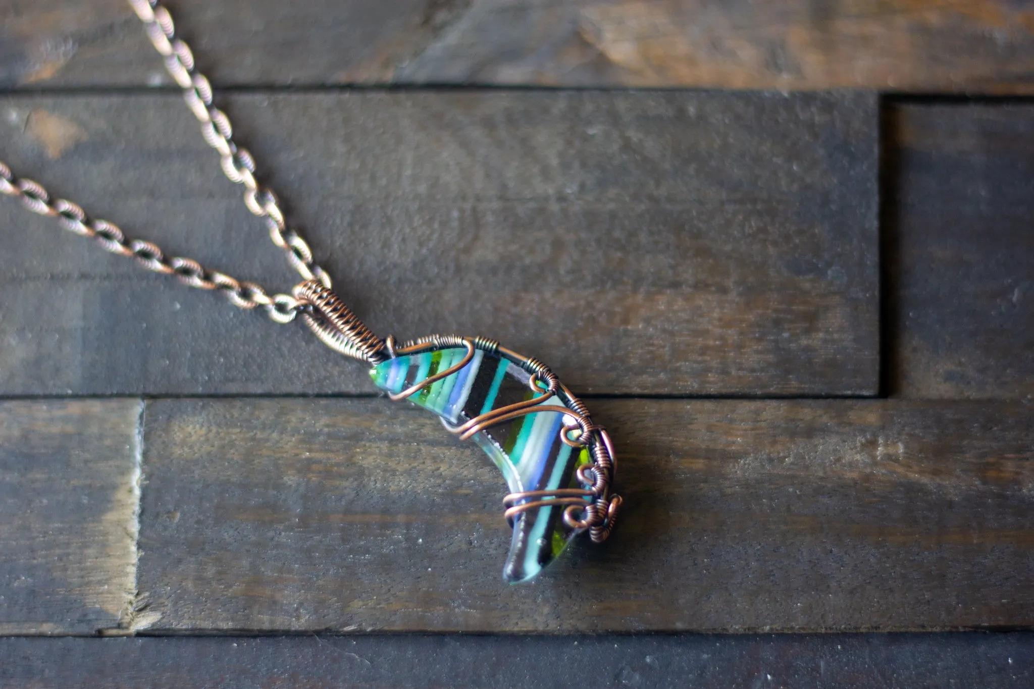 Streaks of Blue and Green Crescent Moon Pendant with Copper Wire Wrapping
